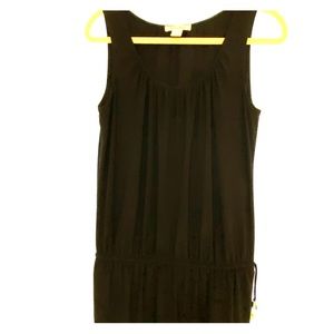 Black sleeveless top.